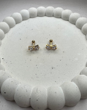 Aτσάλινα σκουλαρίκια χρυσά βιδωτά φιογκάκια με κρύσταλλα (Ιδανικά για όλες τις τρύπες του αυτιού π.χ. τράγος, helix, κ.α.)