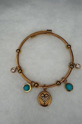 Ατσάλινη χειροπέδα χρυσή με κρεμαστά