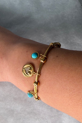 Ατσάλινη χειροπέδα χρυσή με κρεμαστά