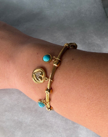 Ατσάλινη χειροπέδα χρυσή με κρεμαστά